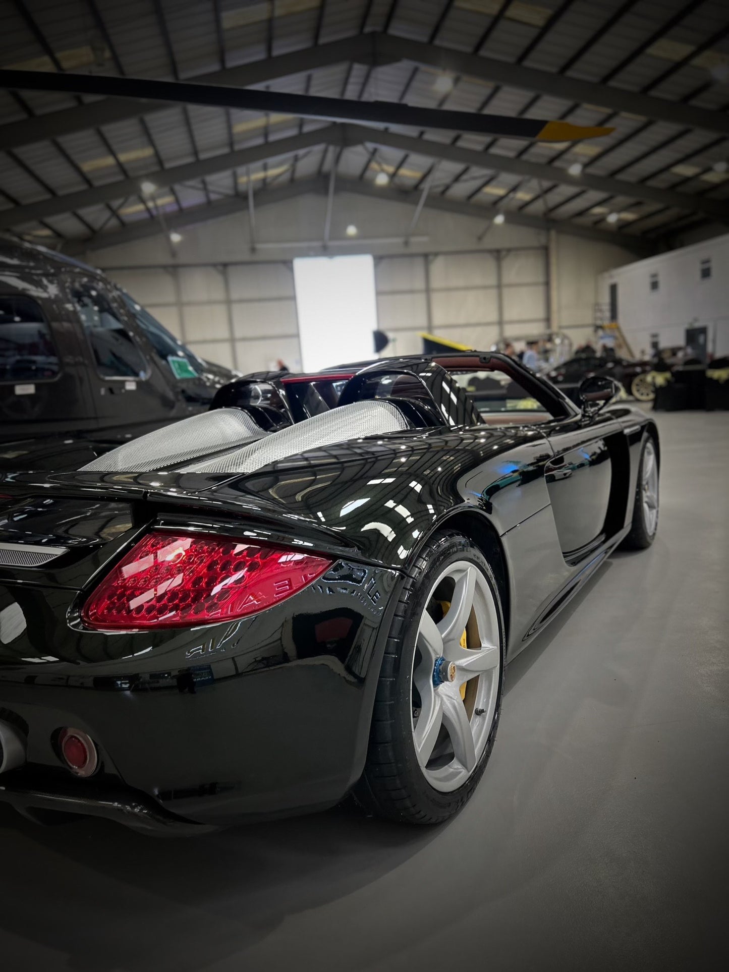 very glossy paint on car, side back view of porsche carrera gt, freshly cleaned east midlands