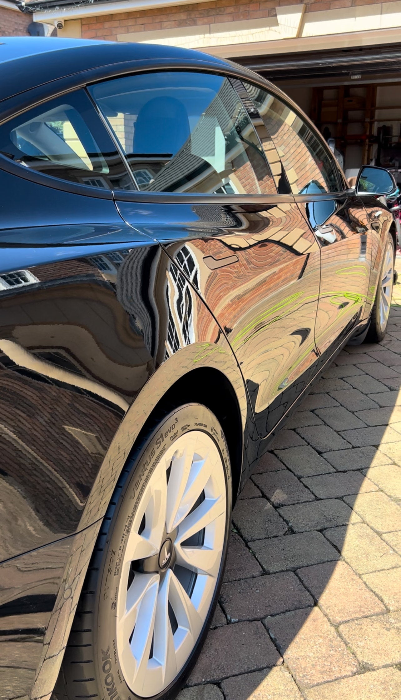 tesla model 3, side view of gloss on paintwork, car detailing in kibworth, east midlands