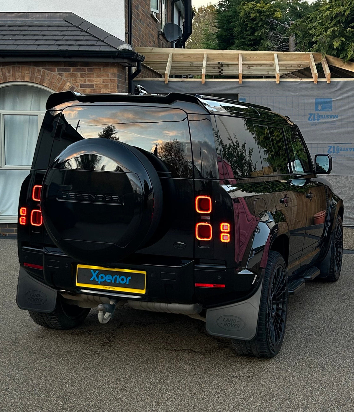 Blacked out SUV that is cleaned and has glossy paint