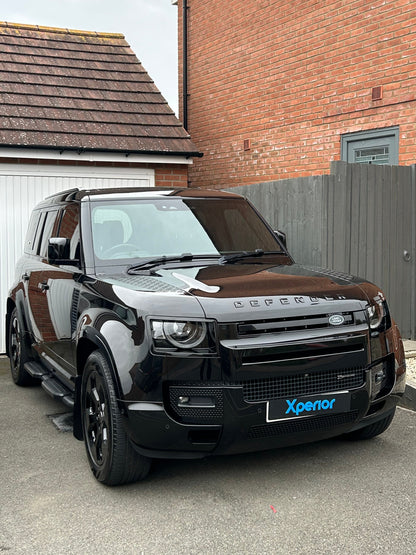 Land rover defender freshly polished and ceramic coated on a driveway looking very glossy