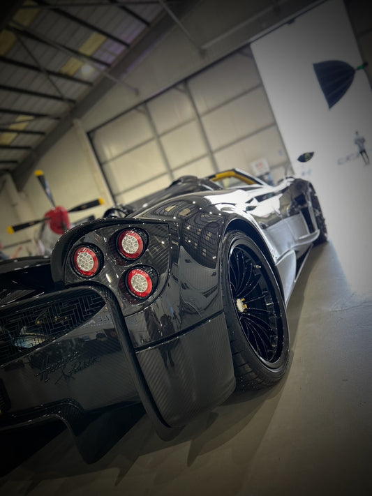 pagani huayra carbon fibre edition hypercar, back view very glossy