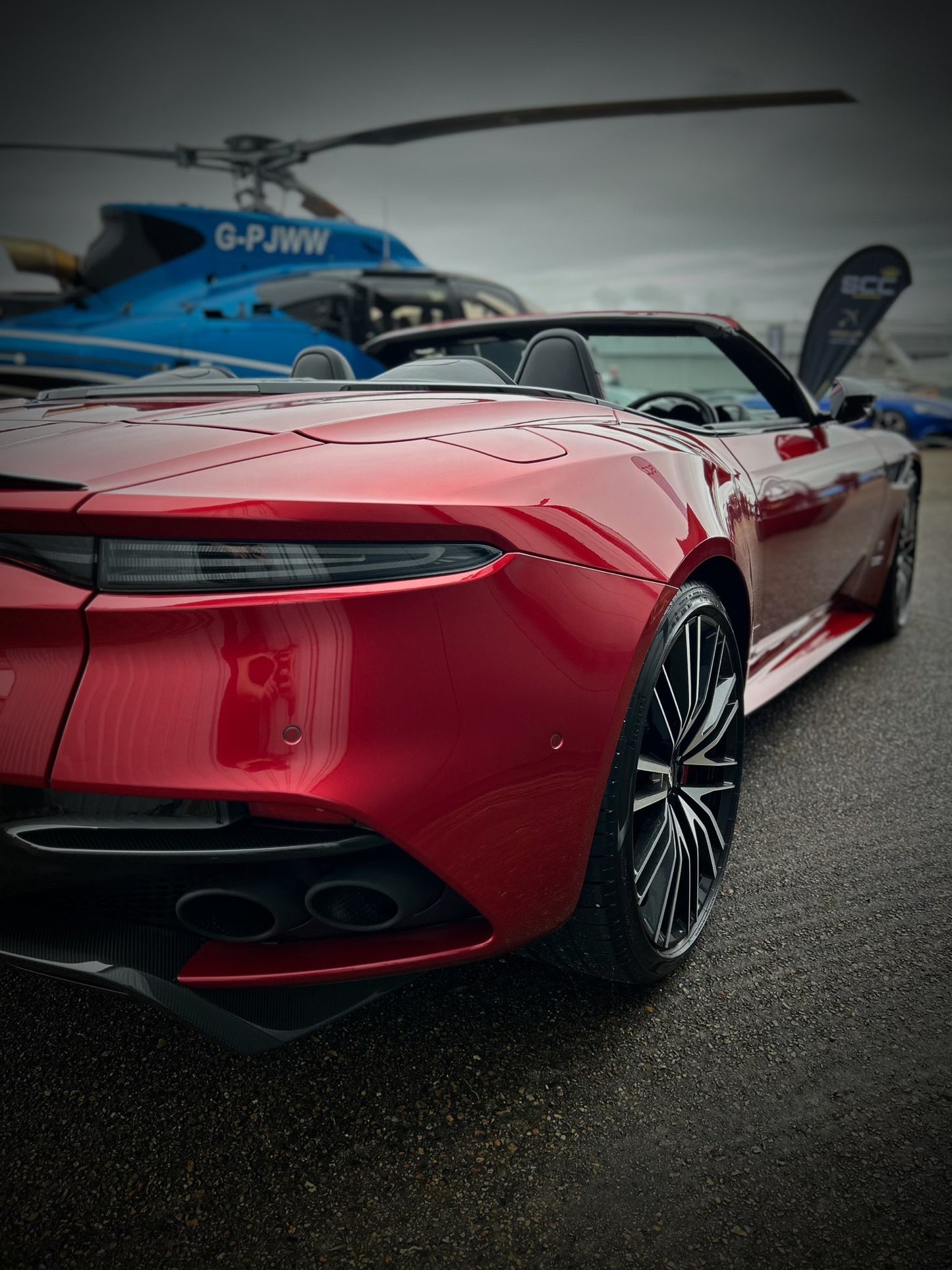 aston martin DBS, red glossy colour, back side view