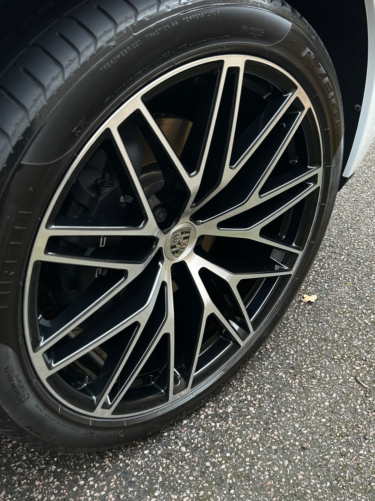 Close-up of a Porsche alloy wheel with a detailed rim that is glossy after getting cleaned
